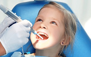 Small child rceiving dental exam