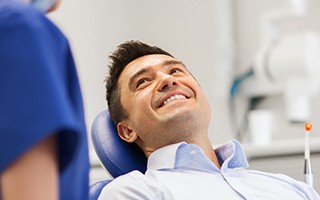 Smiling man in dental chair