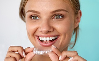 Woman placing ClearCorrect tray